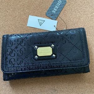 Black Guess with tan interior card holder
